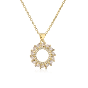 Detail of gold wreath pendant necklace with sparkling cubic zirconia leaf details