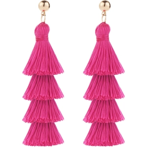 Macro detail of magenta four-tier tassel earrings with golden metallic studs for summer