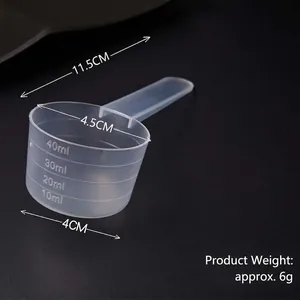 Translucent plastic measuring spoon with 10-40ml scale for baking and laundry