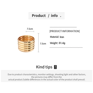 Macro detail of 5-piece minimalist gold metallic geometric bangles with iron material info