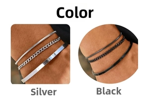 Three-piece set of stacked bracelets in silver and black with snake, cuban, and bangle chains