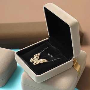 Exquisite gold butterfly necklace with zircon stones in a premium beige velvet jewelry box