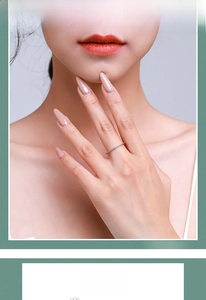 Close-up of minimalist S925 silver ring set with turquoise stones on model finger