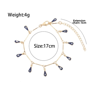 Detail of gold evil eye bracelet with blue teardrop charms and 5cm extension chain