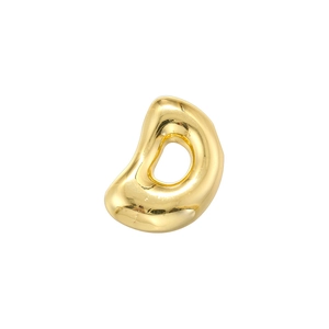 Macro detail of glossy gold bubble letter bead with smooth mirrored reflective surface
