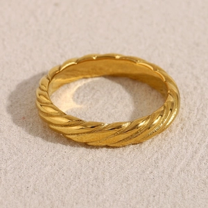 Macro shot of 18K gold plated stainless steel ring featuring fine twisted rope texture