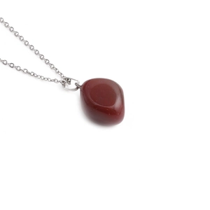 Minimalist silver necklace featuring a smooth irregular red jasper gemstone pendant