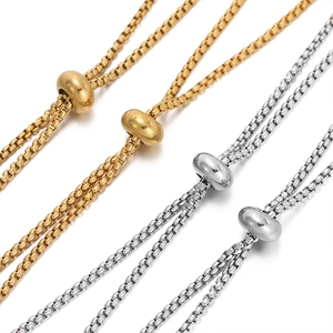 Detail showing adjustable gold and silver stainless steel slider beads on box chains