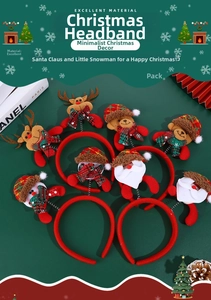 Detail of Christmas headbands featuring reindeer and Santa plush toys on red fabric