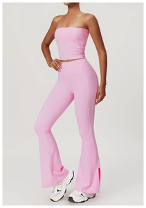 Pink yoga set showing side slit flared pants and white overlock stitching detail