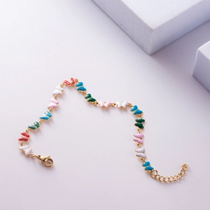 Colorful butterfly charm bracelet in gold-plated steel with vibrant enamel pendants