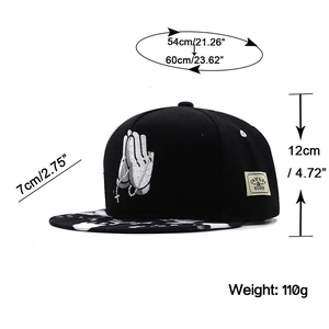 Black snapback baseball cap with praying hands embroidery and marble print brim
