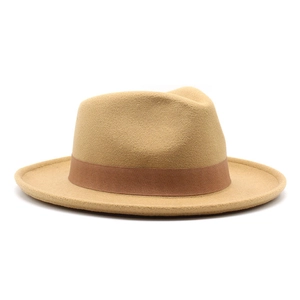 Detail of wool fedora hat featuring classic brown ribbon and wide brim texture