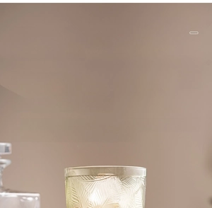 Detail of relief glass goblet featuring wide mouth design for yogurt and ice cream