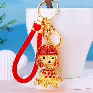 Sparkling red rhinestone poodle dog keychain with golden hardware and leather strap