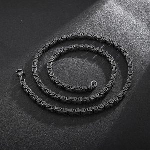 Men's black titanium steel Byzantine chain necklace with lobster clasp on dark background