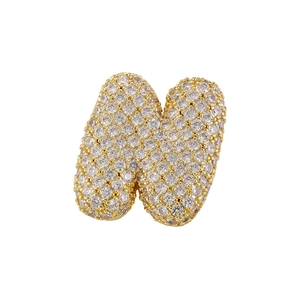 Close-up of golden alphabet N pendant with pavé set cubic zirconia on white background