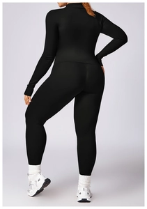 Back view of slim fit black long sleeve sports top and high waist yoga leggings set