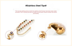 Detailed macro of gold vacuum plated stainless steel jewelry with pearl and zircon inlay