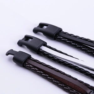 Close-up of three woven leather anchor bracelets with black clasps in varied colors