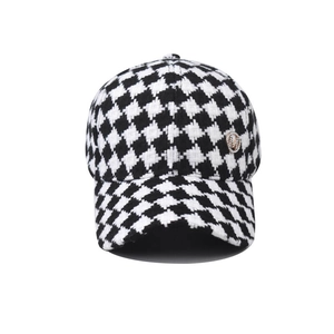 Classic houndstooth baseball cap with gold M logo and black-white tweed texture
