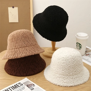 Chic winter faux shearling bucket hats in black, khaki, caramel, and beige colors