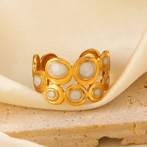 Gold plated stainless steel geometric open ring with white enamel inlay on silk and stone