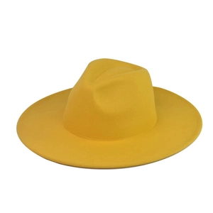 Detail view of ginger yellow wool felt fedora with a wide brim and classic flat top style