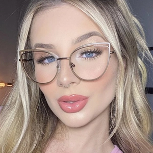Close-up of cat-eye metal glasses frame in rose gold finish on fashion model