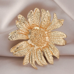Exaggerated golden sunflower open ring with textured metallic petals on silk