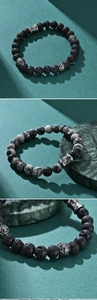 Detailed macro of volcanic lava stone and white natural rock beads with silver accents