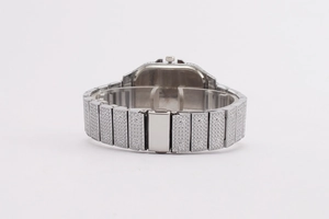 Detail view of iced-out silver metal watch band and folding clasp with sparkling crystals