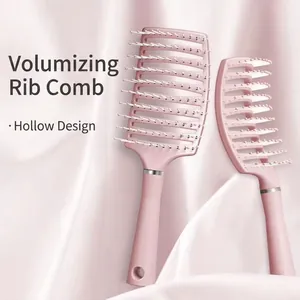 Pink vented hairbrush set with ergonomic curved rib design for voluminous blowouts