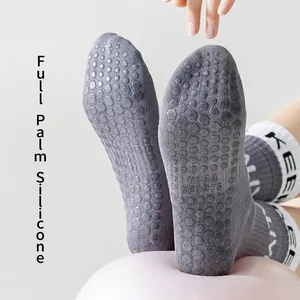 Thick elastic yoga socks with full-sole silicone grip and mid-calf knit design
