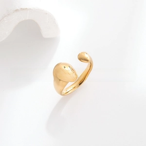 Macro view of adjustable 18k gold plated stainless steel ring with polished teardrop ends