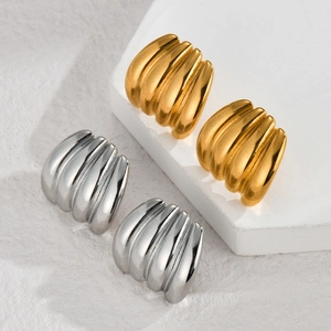 Modern 18k gold and silver stainless steel earrings with textured geometric ridges