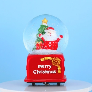 Festive Christmas snow globe with Santa and tree on a red base with merry Christmas text