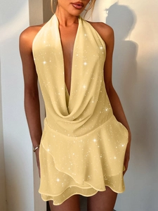 Elegant yellow halter neck mini dress with sparkly fabric and layered ruffle hem