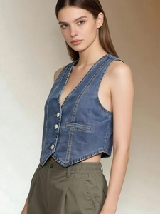Fashionable blue denim vest for women featuring a V-neck and short cropped fit style