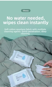 Detailed view of an 80-pack down jacket cleaning wipe being used on grey fabric