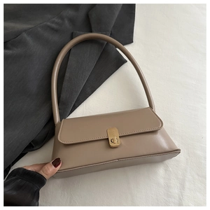Close-up of khaki PU leather baguette bag featuring a stylish square gold buckle