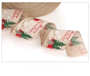 Detail view of rustic burlap Christmas ribbon with red truck and green tree pattern