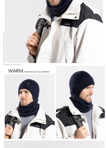 Detail of navy blue winter knitted beanie and neck warmer set with vertical stripe texture