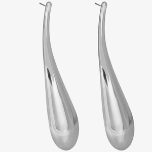 Detailed view of large silver teardrop earrings with a polished mirror finish surface