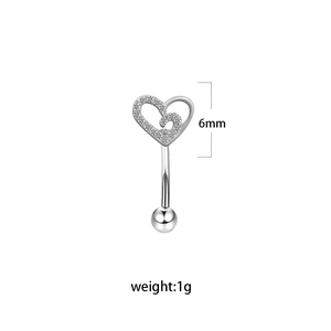 Detail of 6mm heart-shaped stainless steel eyebrow ring with inlaid zircon stones