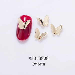 Detail of 9x8mm 3D hollow gold metal butterfly nail charms showing size and application