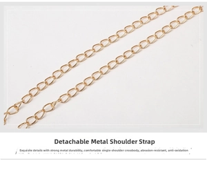 Detail of a polished gold metal chain strap with classic circular link structure
