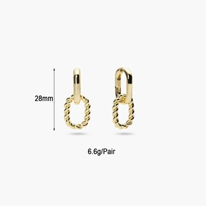 Detail view of gold interlocked hoop earrings showing 28mm length and 6.6g weight specs