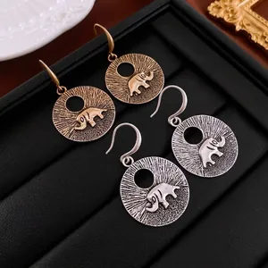 Boucles d'oreilles ethniques avec motif éléphant en finitions or et argent