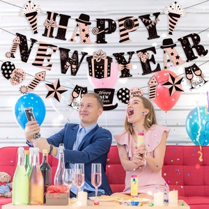 Rose gold Happy New Year party banner set with glitter letters and hanging decorations
